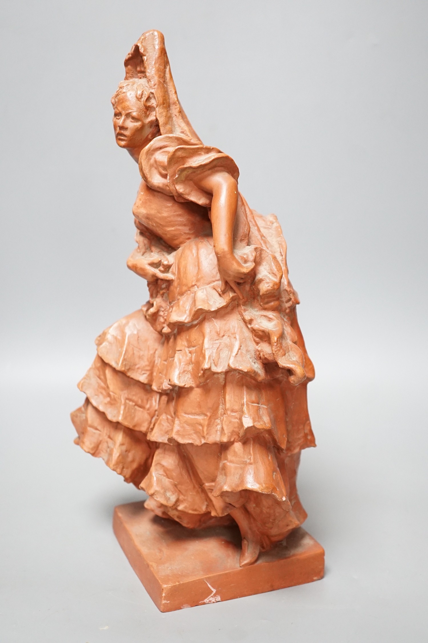 A red composition figure of a Spanish dancer, indistinctly signed to reverse, 34cm tall